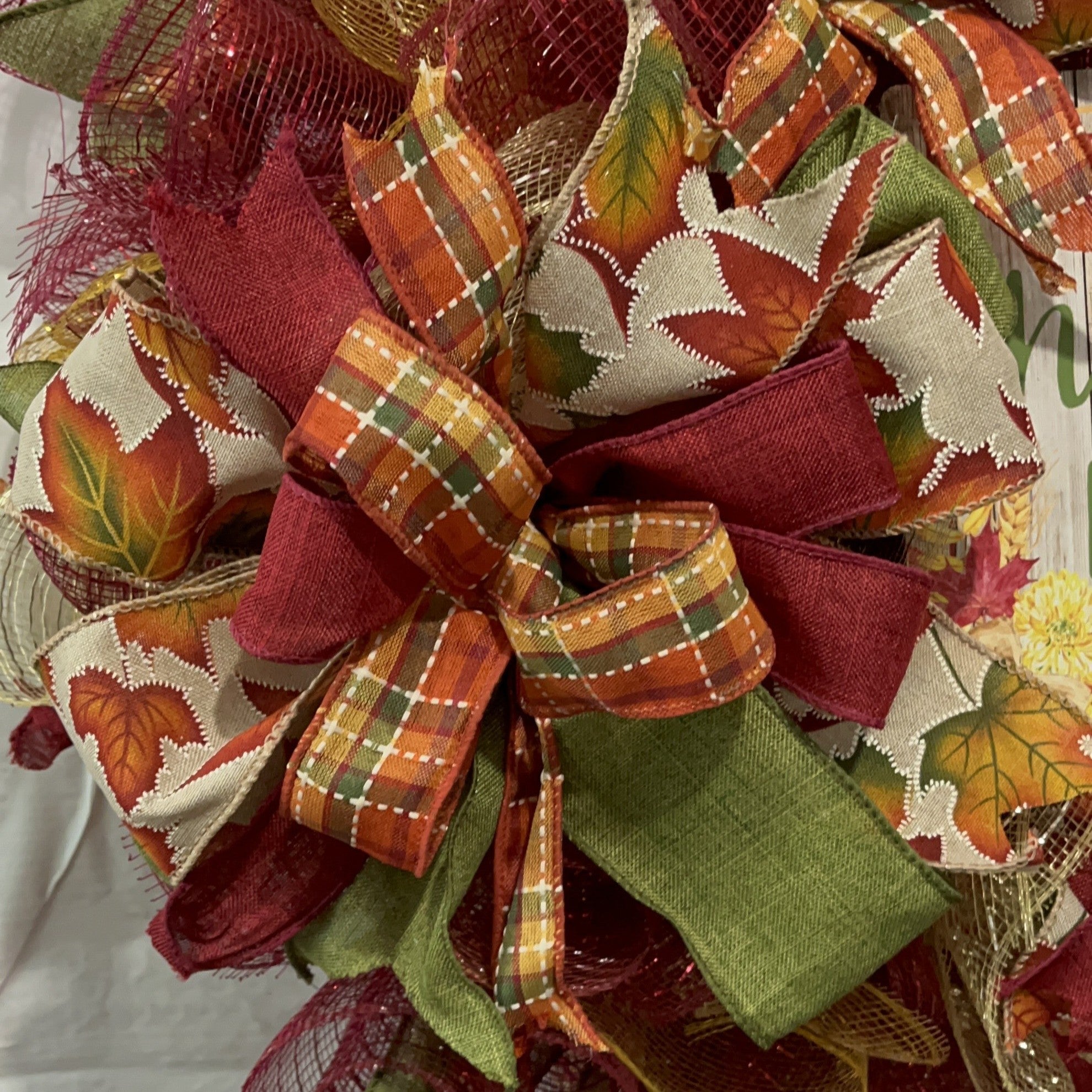 Handmade fall wreath with red, gold, and green mesh featuring a ‘Harvest Blessings’ sign, perfect for autumn and Thanksgiving front door decor.