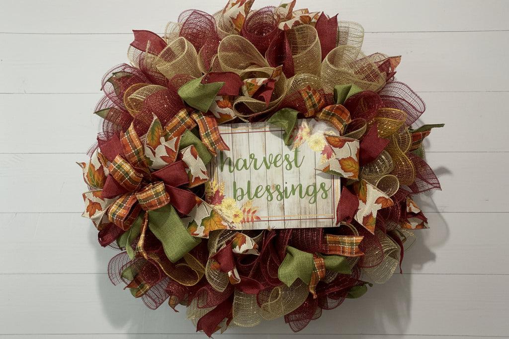 Handmade fall wreath with red, gold, and green mesh featuring a ‘Harvest Blessings’ sign, perfect for autumn and Thanksgiving front door decor.