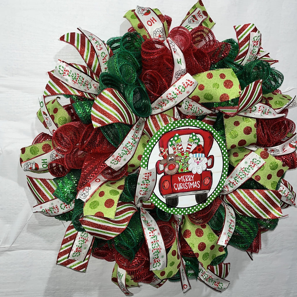 Whimsical Santa & Reindeer Truck Christmas Wreath – Festive Red & Green Door Decor