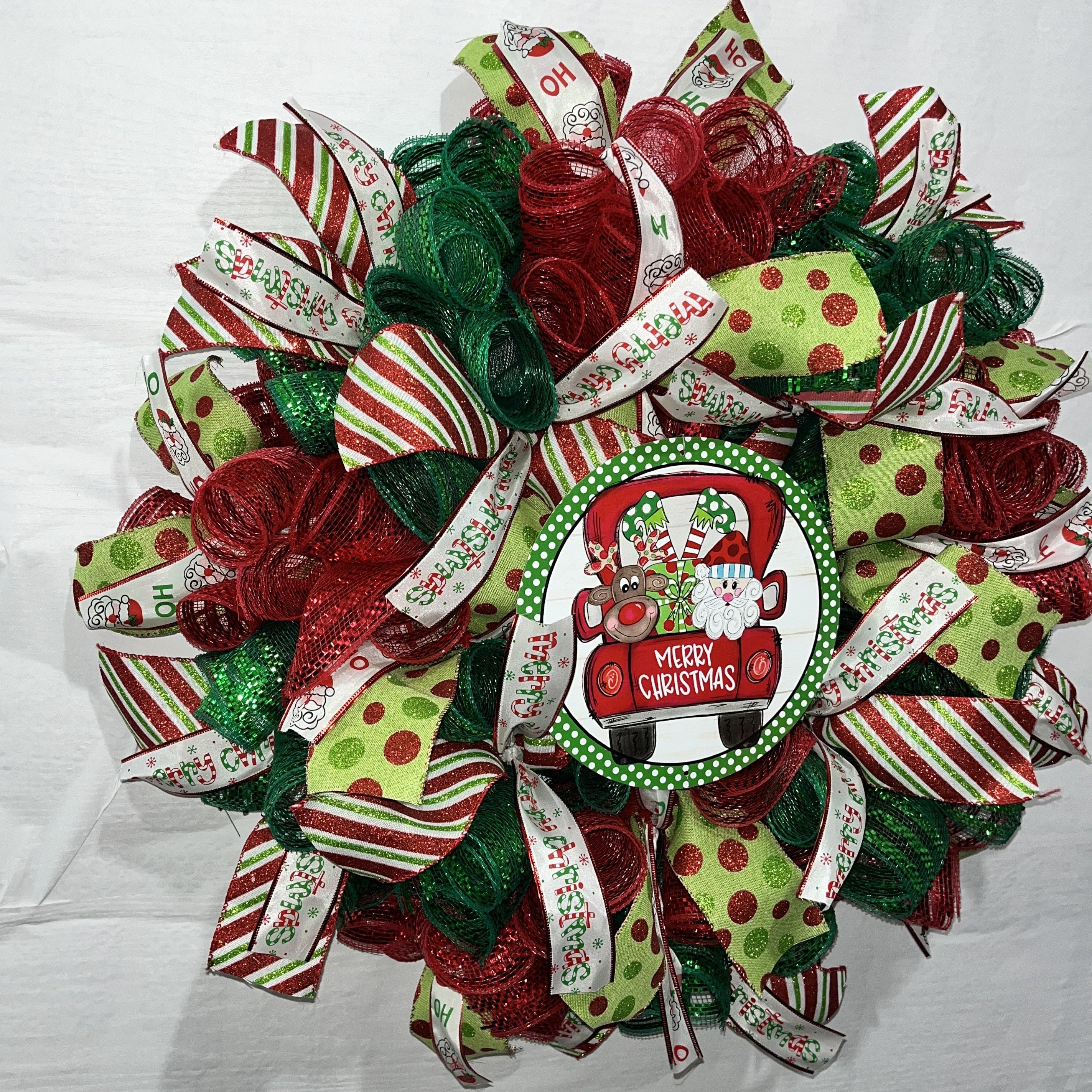 Whimsical Santa & Reindeer Truck Christmas Wreath – Festive Red & Green Door Decor