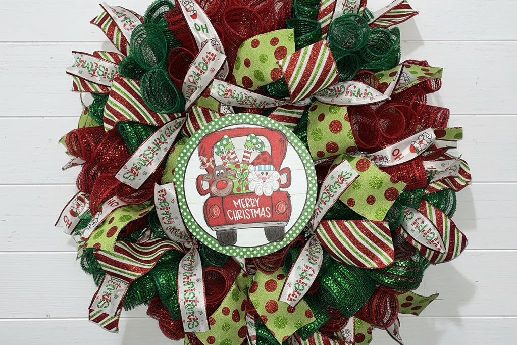 Whimsical Santa & Reindeer Truck Christmas Wreath – Festive Red & Green Door Decor